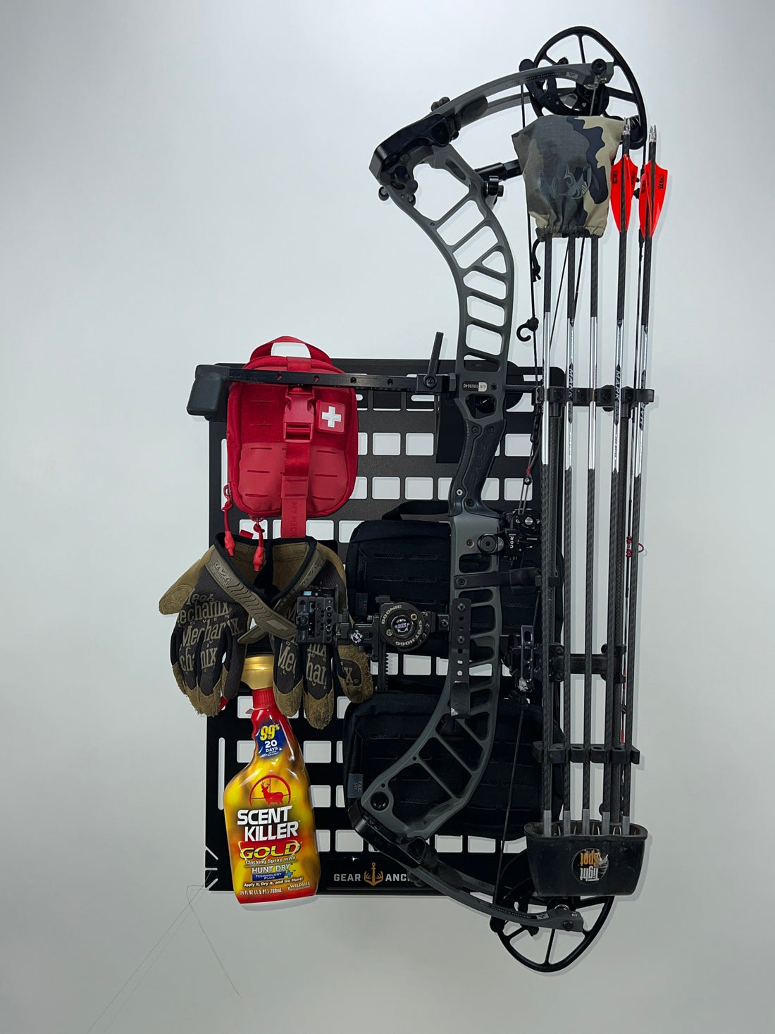 Gear Anchor MOLLE panel fully loaded with hunting gear, including bow accessories, optics, pack, and mounted pouches